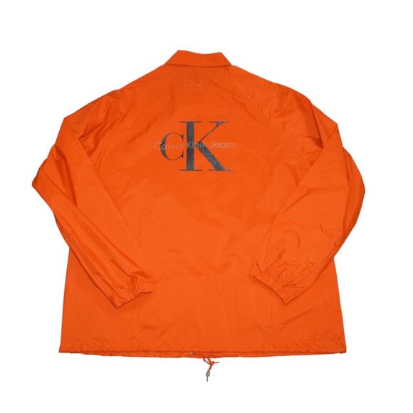 Vintage 90s Calvin Klein Jeans CK Logo Coach Jacket Orange Windbreaker Size L - Picture 1 of 14